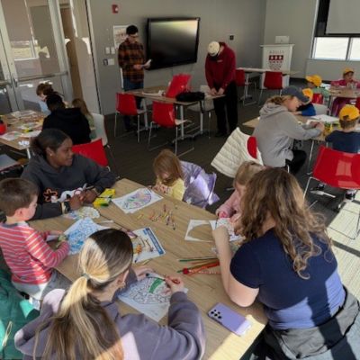Students in Intro to Neuroscience class at the Regis Children's Center during Brain Awareness Week event